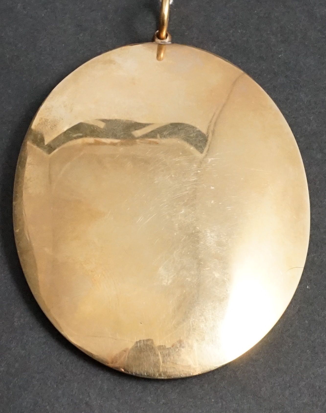 Mrs Anne Mee, née Foldsone (British, 1775-1851), Portrait miniature of a lady wearing a white dress and gold chain with a heart shaped locket, watercolour on ivory, 7.6 x 5.8cm. CITES Submission reference HQJ8KNQ9